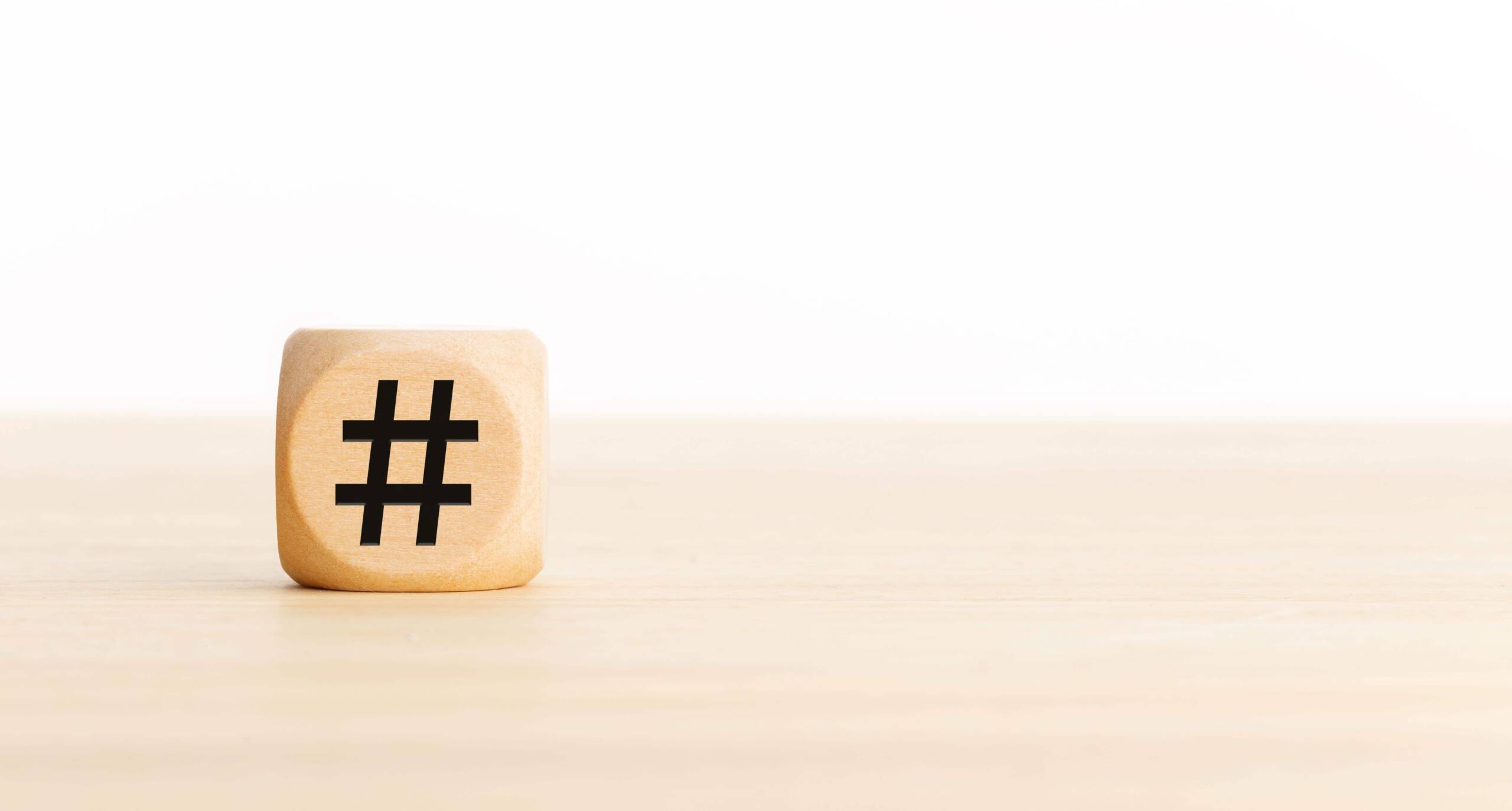 hashtag symbol on wooden cube 2022 12 16 11 14 26 utc scaled 1