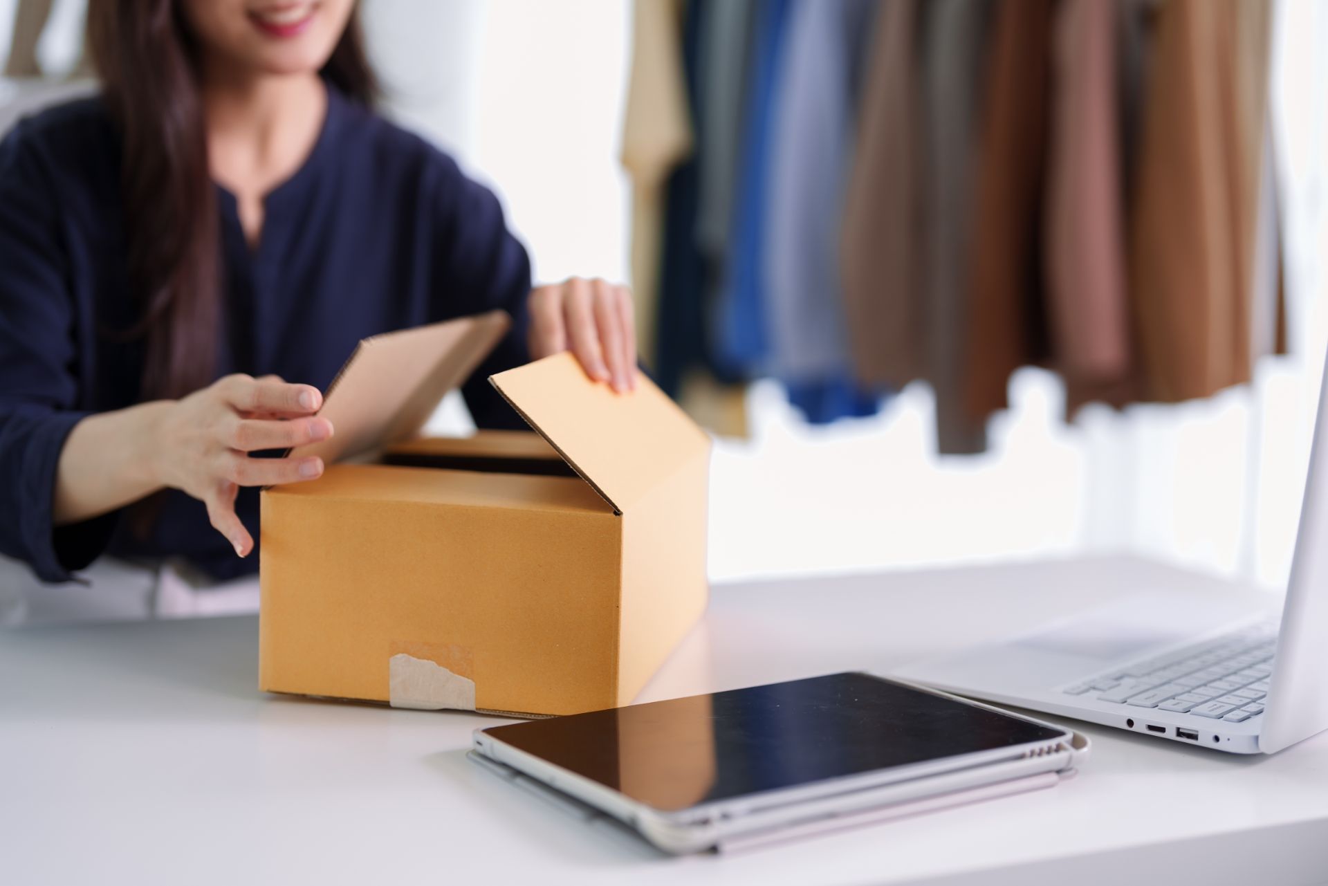 entrepreneur packing a cardboard box for e commerc 2026 07 08 22 43 47 utc 1920x1281 1